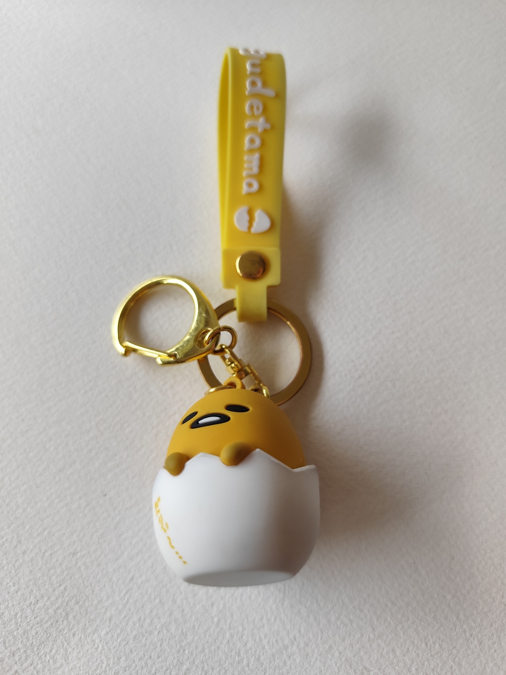 3/$20💗Gudetama keychain with yellow egg character with a white eggshell